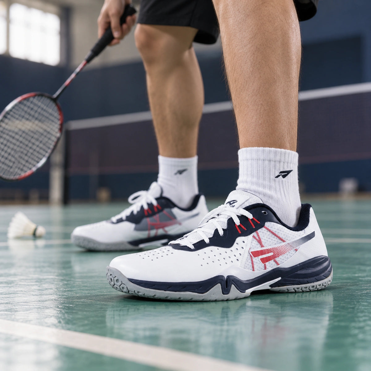 SEGA Freedom 4.0 white, navy and red court shoes worn between badminton rallies