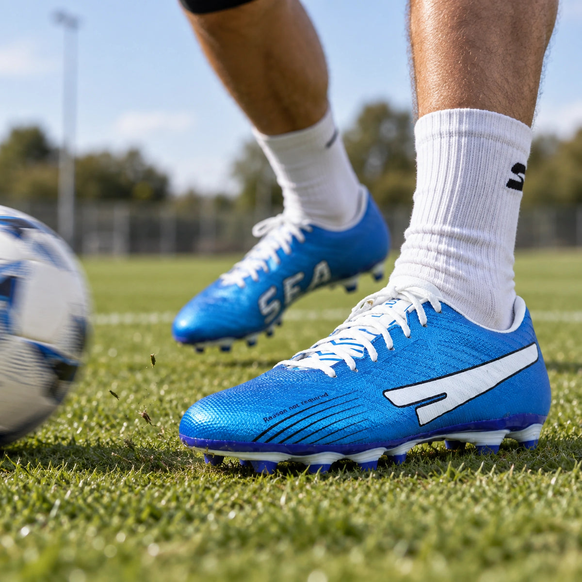 Blue SEGA Lexus football boots worn during a passing drill